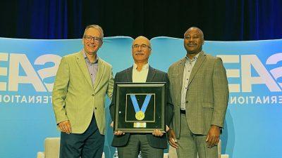 (From left) Audley Brown, Vice President of the Commercial Vehicle Sector of the Society of Automotive Engineers (SAE), presents the Medal of Honor to Mehdi Ahmadian with Gregory L. Bradley, Interim SAE CEO and Chief Legal Officer. Photo courtesy of SAE.